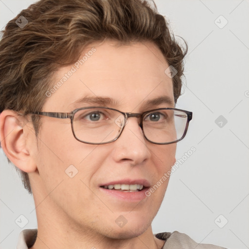 Joyful white adult male with short  brown hair and grey eyes