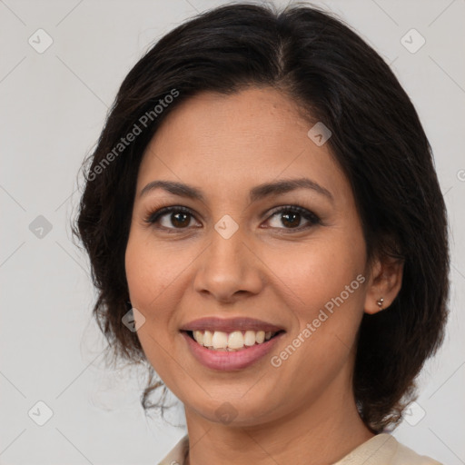 Joyful latino young-adult female with medium  brown hair and brown eyes