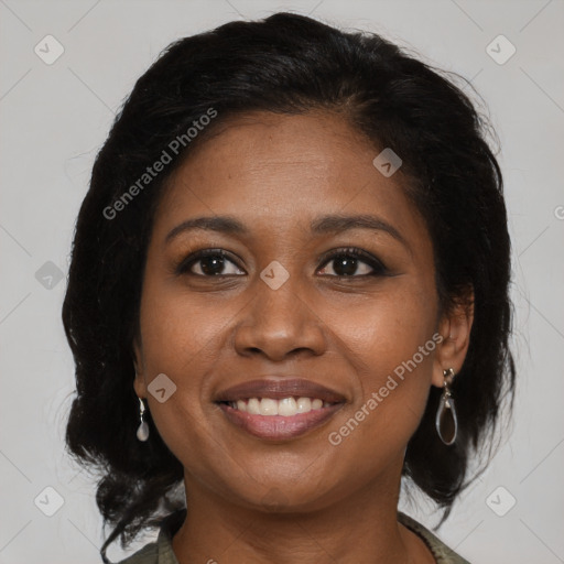 Joyful black young-adult female with medium  brown hair and brown eyes