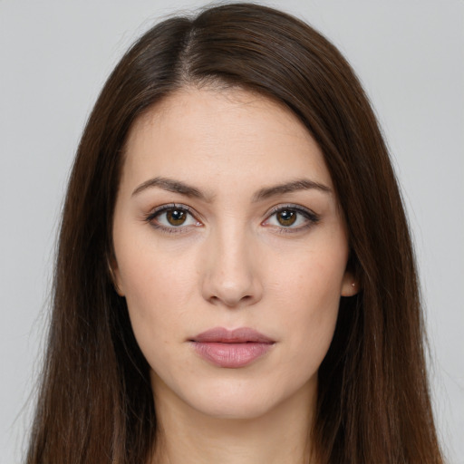 Neutral white young-adult female with long  brown hair and brown eyes