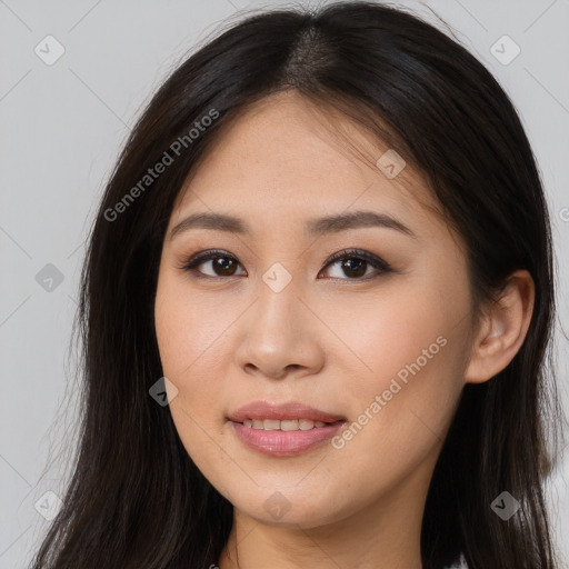 Joyful asian young-adult female with long  brown hair and brown eyes