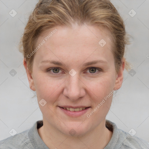 Joyful white young-adult female with short  brown hair and blue eyes