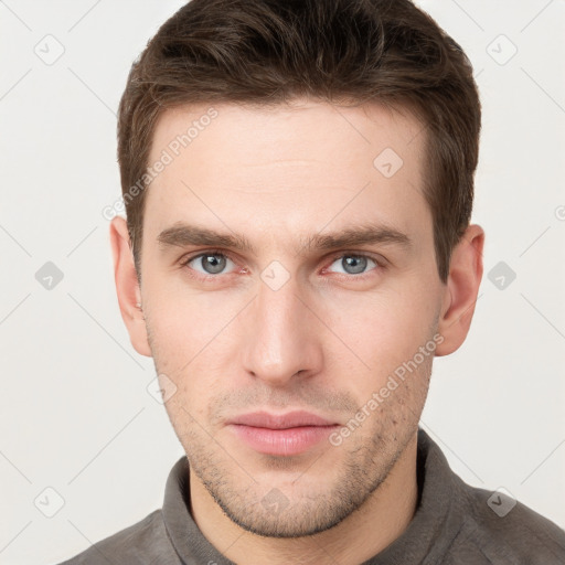 Neutral white young-adult male with short  brown hair and grey eyes