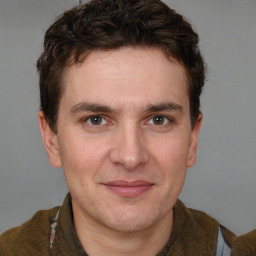 Joyful white adult male with short  brown hair and brown eyes