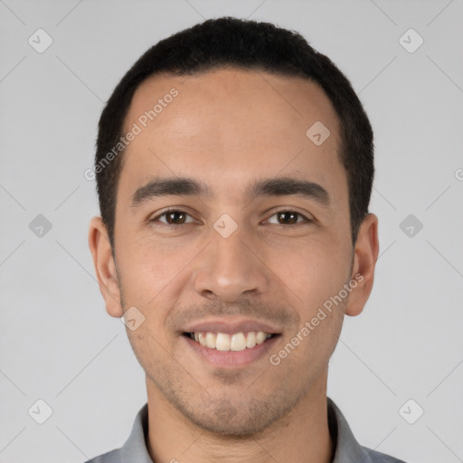 Joyful white young-adult male with short  black hair and brown eyes