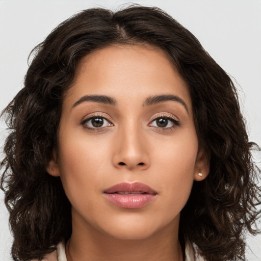 Joyful asian young-adult female with long  brown hair and brown eyes