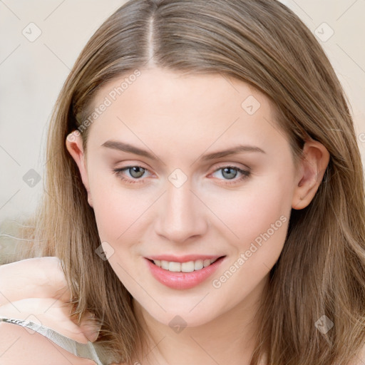 Joyful white young-adult female with long  brown hair and blue eyes