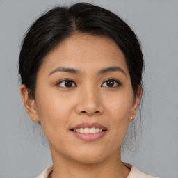 Joyful asian young-adult female with medium  brown hair and brown eyes