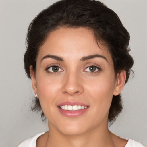 Joyful white young-adult female with medium  brown hair and brown eyes