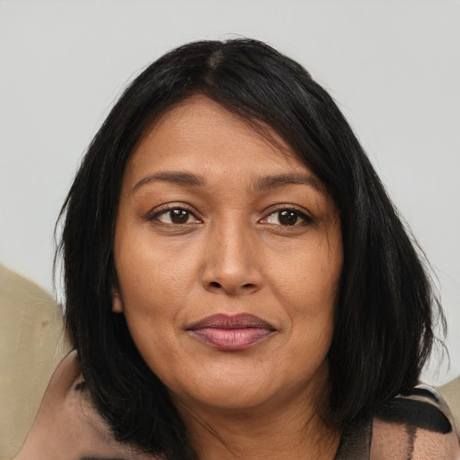 Joyful asian adult female with medium  brown hair and brown eyes