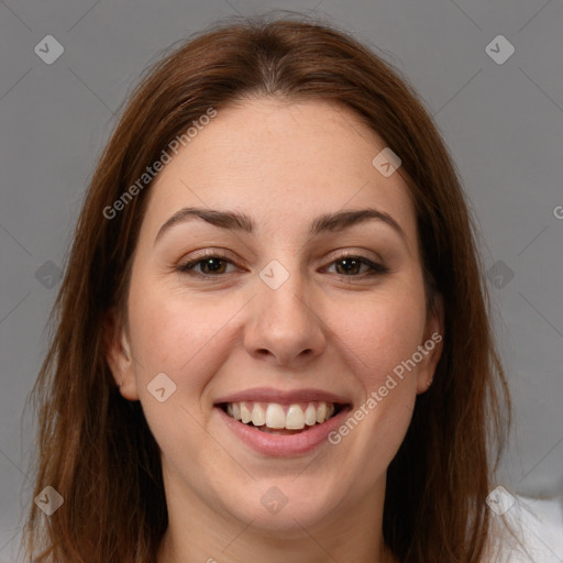 Joyful white young-adult female with long  brown hair and brown eyes