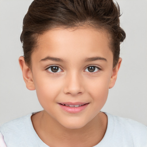 Joyful white child female with short  brown hair and brown eyes