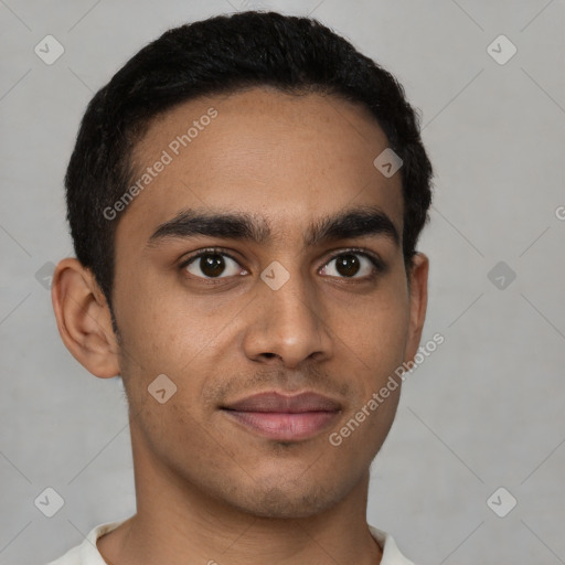 Joyful latino young-adult male with short  brown hair and brown eyes