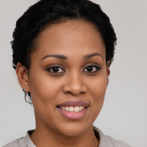 Joyful latino young-adult female with short  brown hair and brown eyes