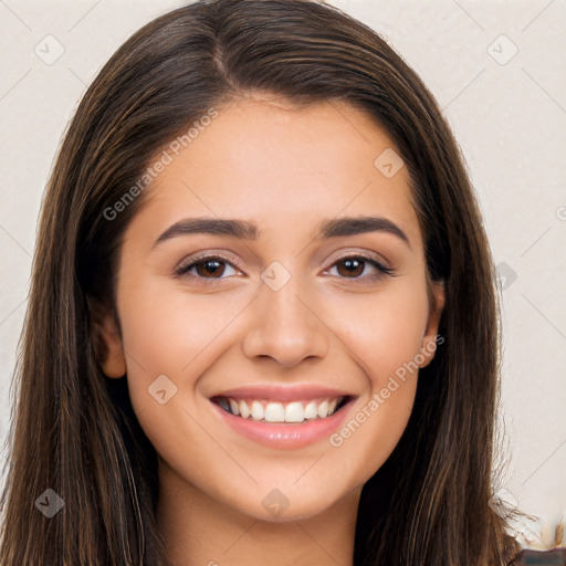 Joyful white young-adult female with long  brown hair and brown eyes
