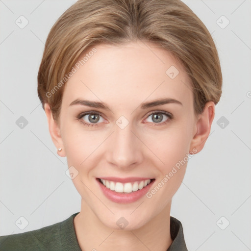 Joyful white young-adult female with short  brown hair and grey eyes