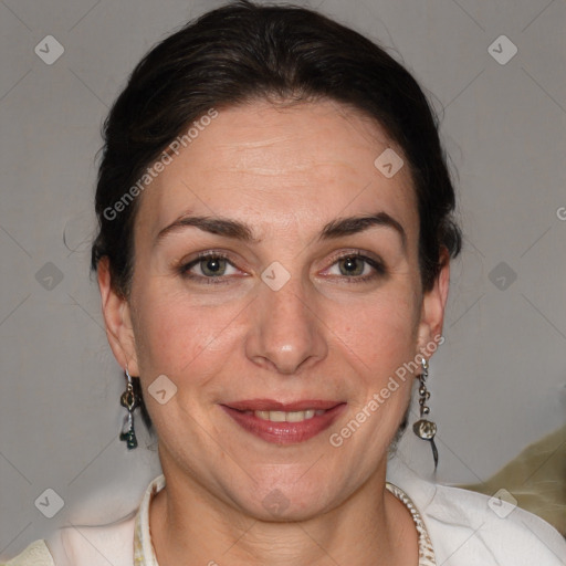 Joyful white adult female with short  brown hair and grey eyes