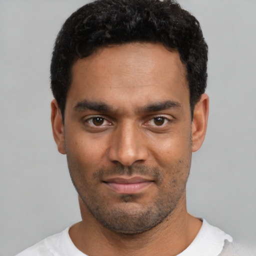 Neutral latino young-adult male with short  black hair and brown eyes