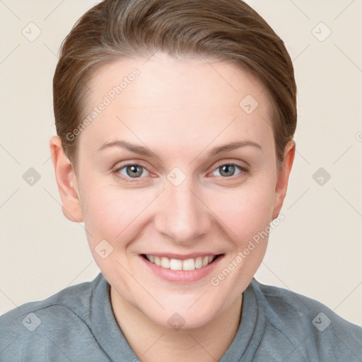 Joyful white young-adult female with short  brown hair and grey eyes