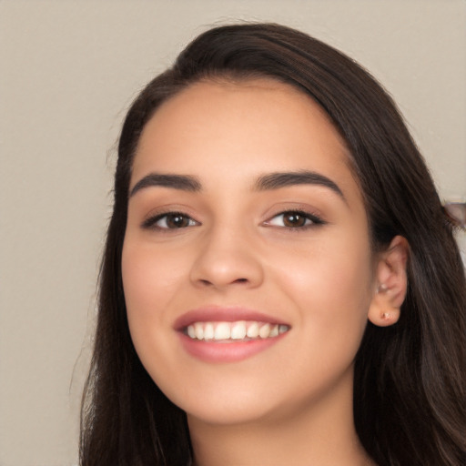 Joyful white young-adult female with long  black hair and brown eyes