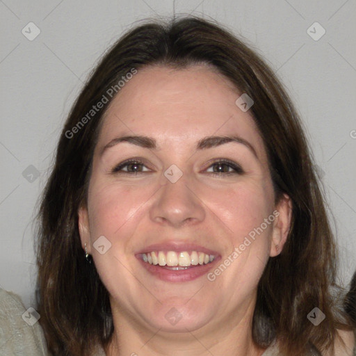 Joyful white adult female with medium  brown hair and brown eyes