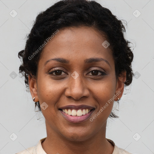 Joyful black young-adult female with short  brown hair and brown eyes