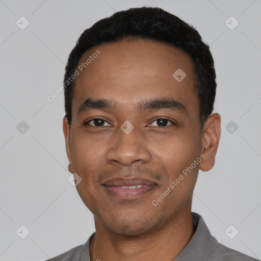 Joyful latino young-adult male with short  black hair and brown eyes