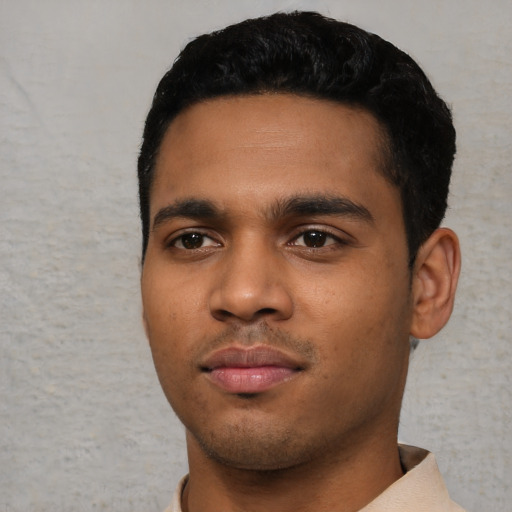 Neutral black young-adult male with short  black hair and brown eyes