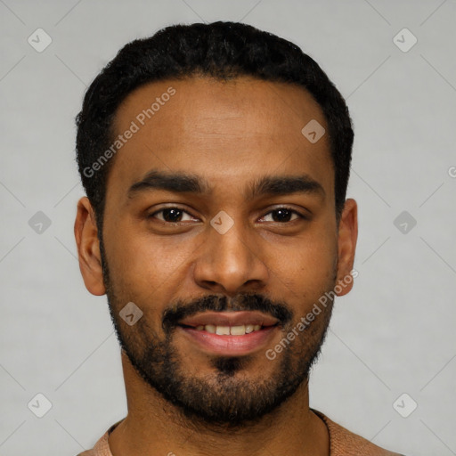 Joyful black young-adult male with short  black hair and brown eyes