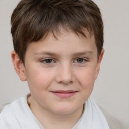 Joyful white child male with short  brown hair and brown eyes