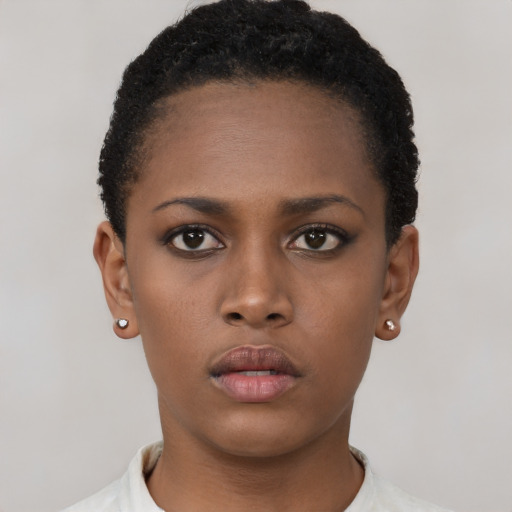 Neutral black young-adult female with short  brown hair and brown eyes