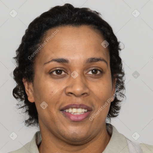 Joyful black adult female with short  brown hair and brown eyes