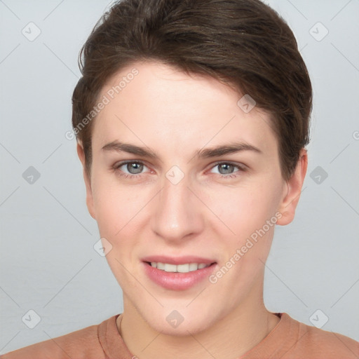 Joyful white young-adult female with short  brown hair and grey eyes