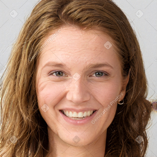 Joyful white young-adult female with long  brown hair and grey eyes