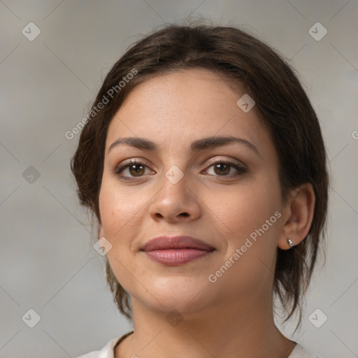 Joyful white young-adult female with medium  brown hair and brown eyes