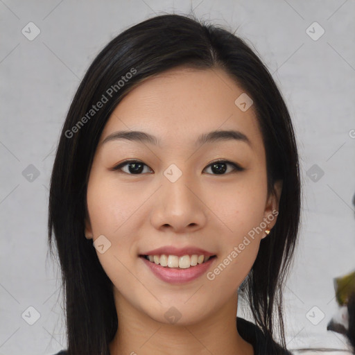 Joyful asian young-adult female with medium  black hair and brown eyes