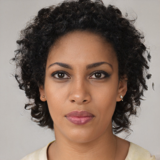 Neutral black young-adult female with medium  black hair and brown eyes