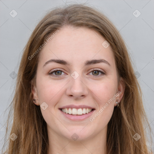 Joyful white young-adult female with long  brown hair and green eyes