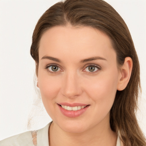 Joyful white young-adult female with long  brown hair and blue eyes