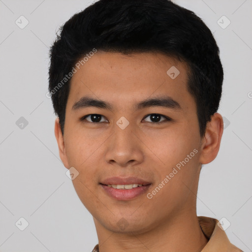 Joyful asian young-adult male with short  black hair and brown eyes