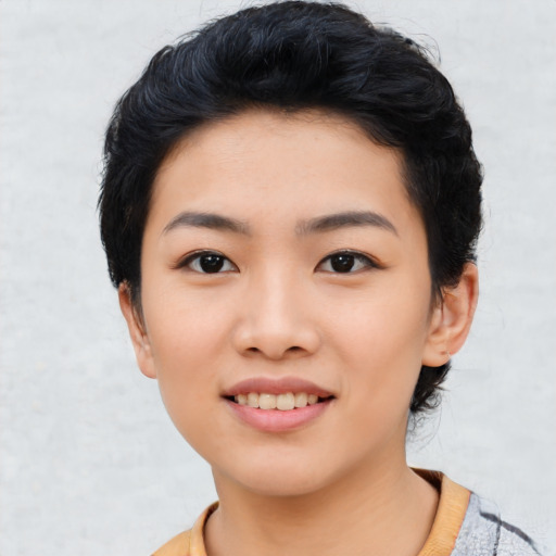Joyful asian young-adult female with short  black hair and brown eyes