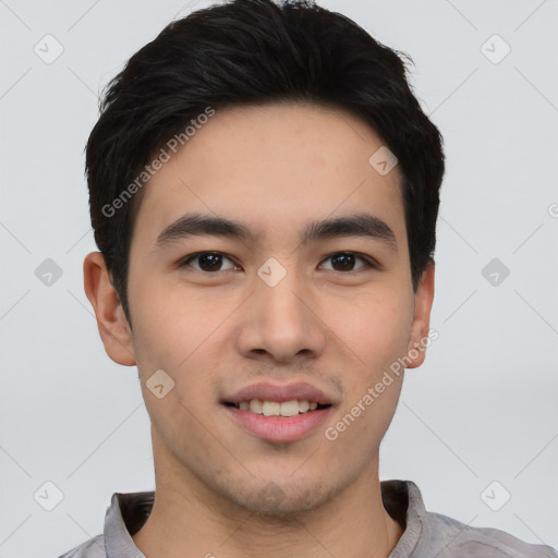 Joyful asian young-adult male with short  black hair and brown eyes