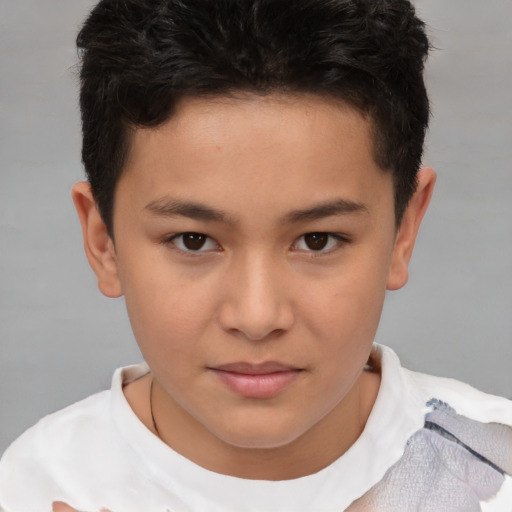 Joyful white child male with short  brown hair and brown eyes