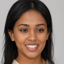 Joyful latino young-adult female with long  brown hair and brown eyes