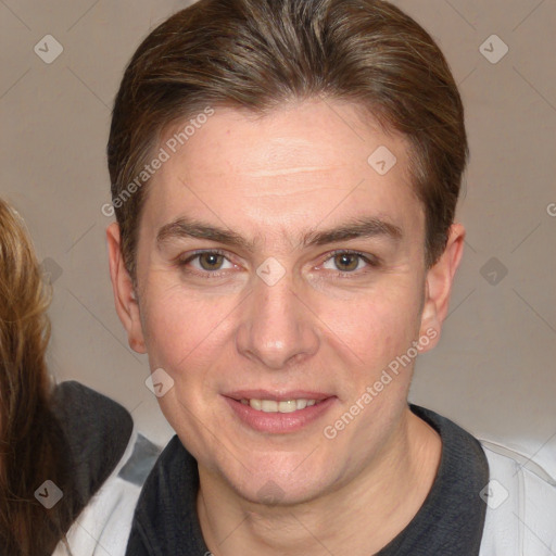 Joyful white adult male with medium  brown hair and brown eyes