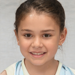 Joyful white child female with short  brown hair and brown eyes