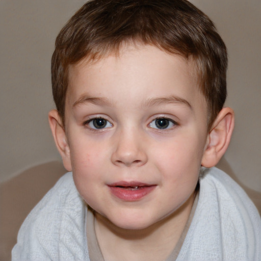 Joyful white child male with short  brown hair and brown eyes