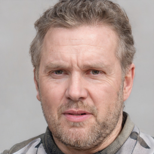 Joyful white adult male with short  brown hair and grey eyes