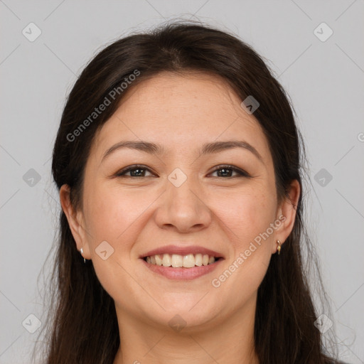 Joyful white young-adult female with long  brown hair and brown eyes