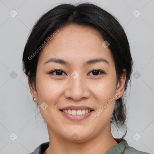 Joyful asian young-adult female with medium  brown hair and brown eyes